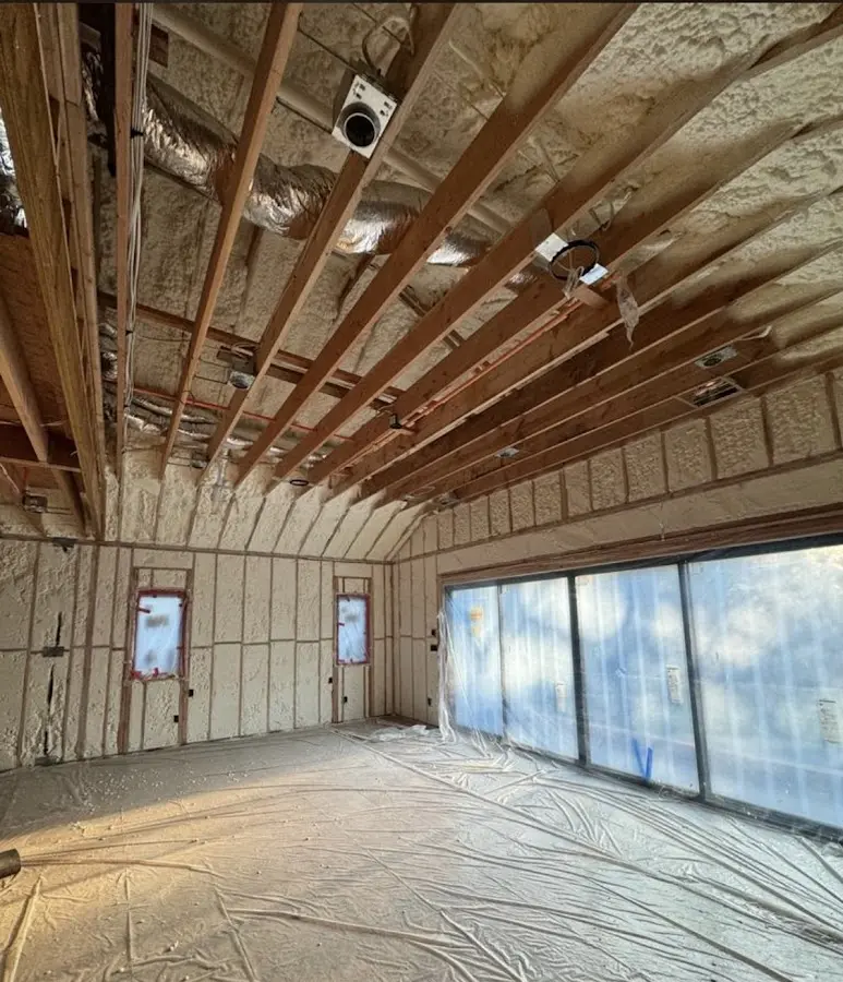 Interior walls and ceiling insulated with spray foam during new construction in New Hope
